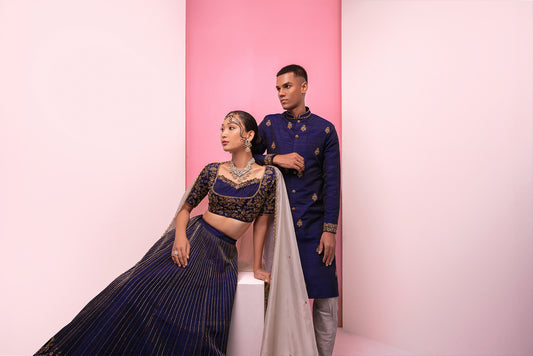 Midnight blue lehenga sherwani couples ensemble