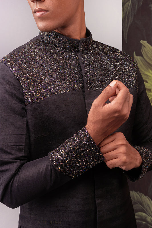 Black hand embroidered chikankari lehenga and sherwani couple ensemble