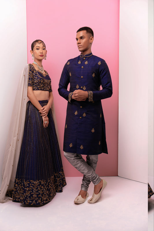 Midnight blue lehenga sherwani couples ensemble