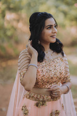 Peach Antique Net Lehenga